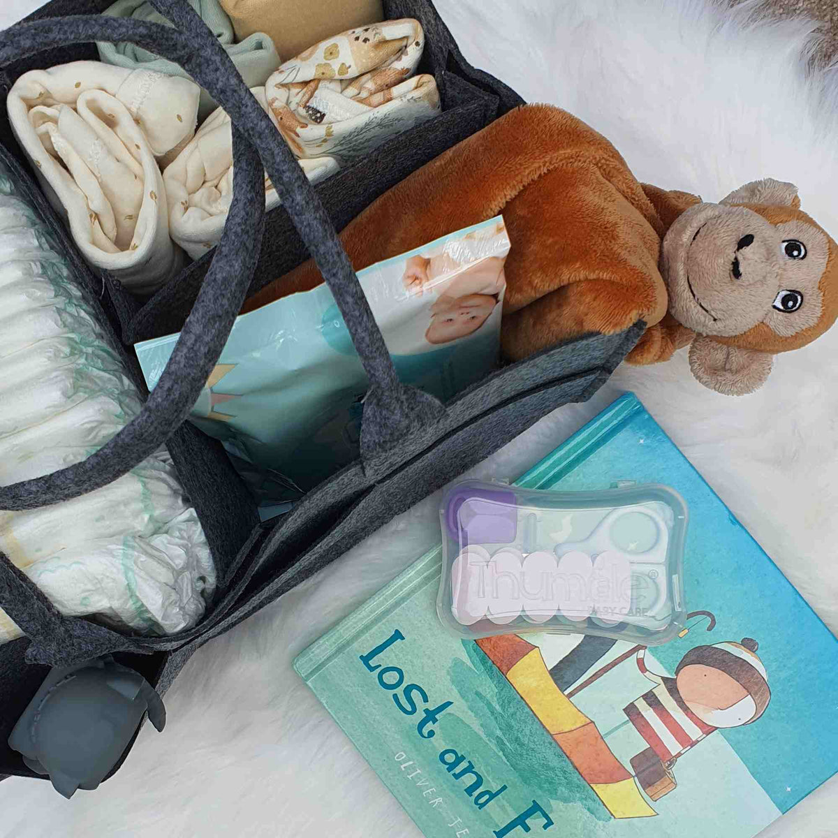 File your baby's nails with the Thumble whilst reading a book